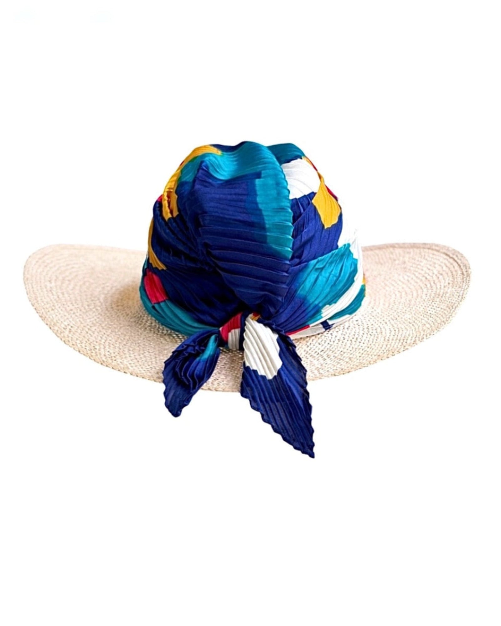 Model wearing the Palm Spring Azure straw hat with silk scarf, inspired by desert light and refined summer elegance.