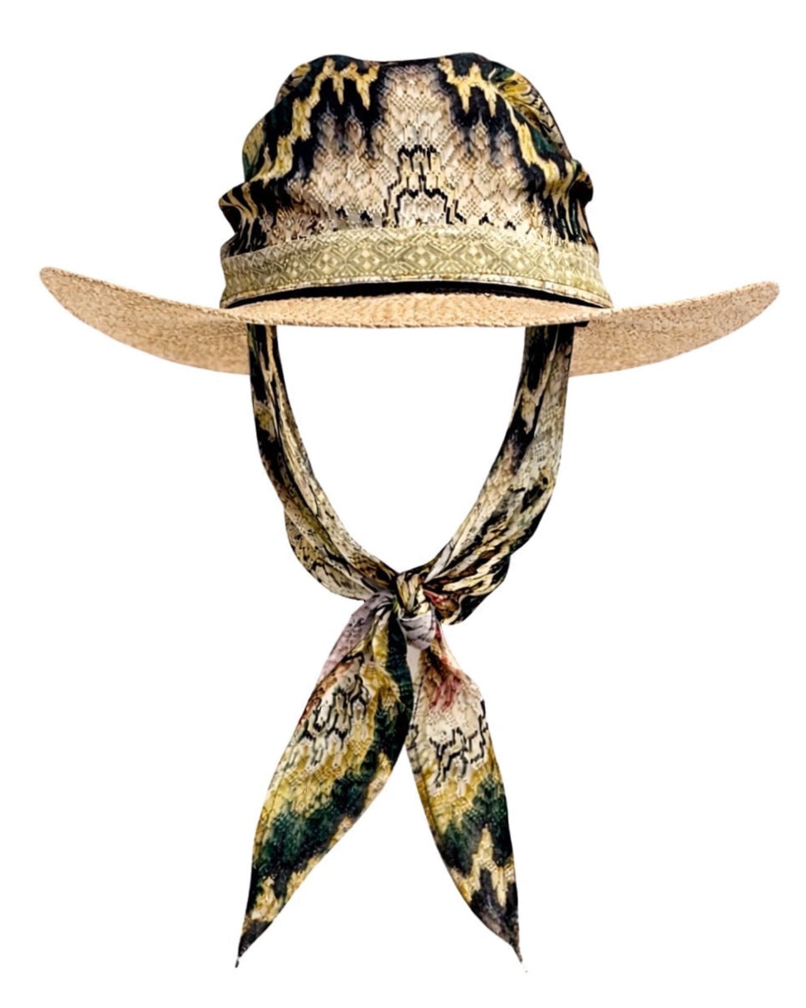 Model wearing the Cairo Kiss straw hat with silk scarf, featuring a soft silhouette with refined, sun-washed style.